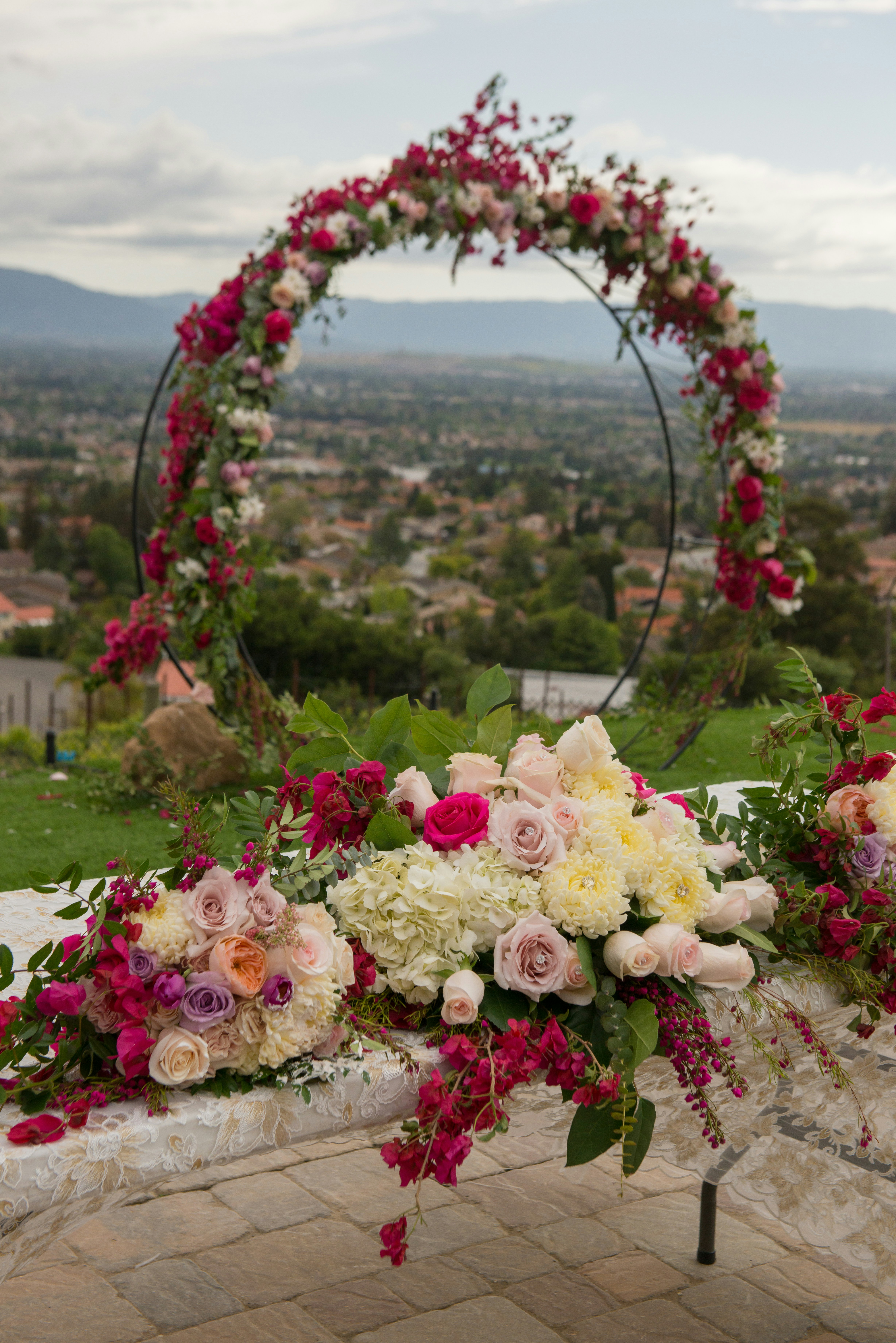 outdoor arch pink purple and white flowers